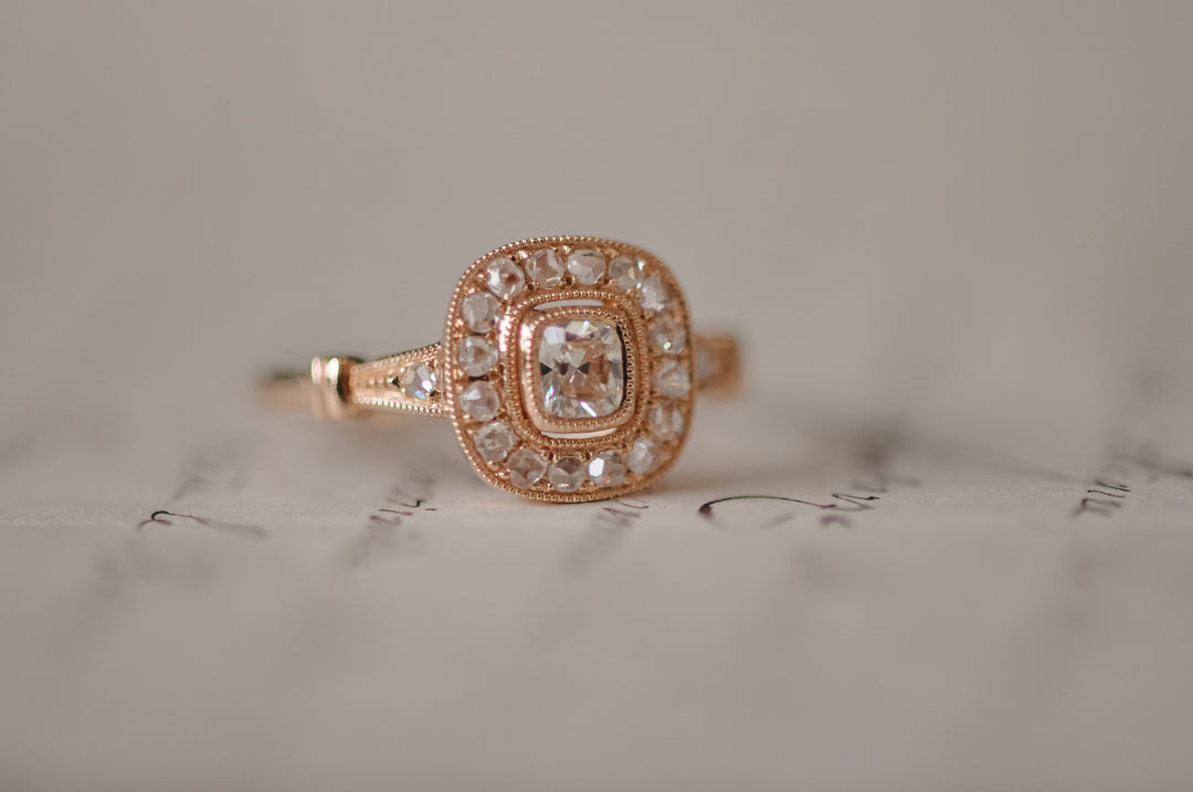 Antique cushion diamond ring